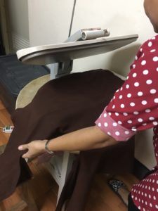 garment being pressed in laundry in chiang mai